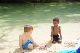 Two children playing at Frenchman's Cove Beach, Jamaica