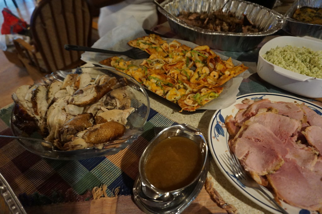 Keto Christmas dinner: roasted chicken, ham, cauliflower rice, sea-food fat head dough pizza, braised oxtail, crust-less callaloo quiche, jerked pork, garden salad