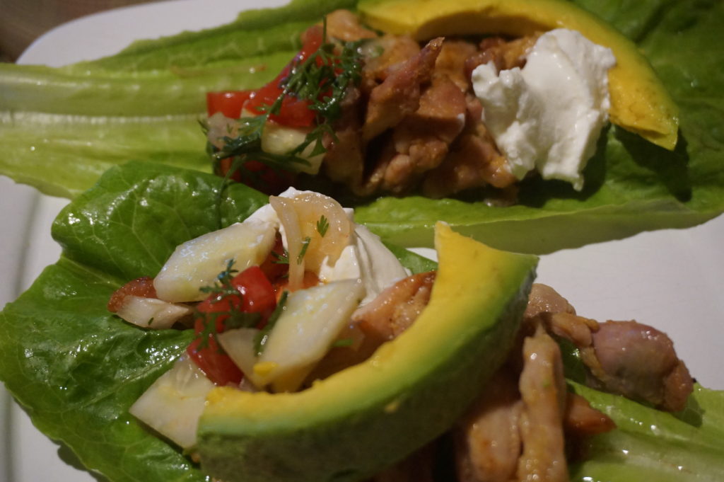 Lettuce wraps with spicy chicken strips, homemade salsa, avocado and sour cream.