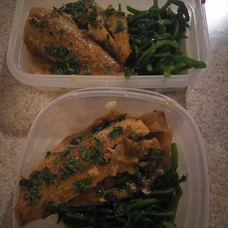 Sliced fish and spinach in meal prep