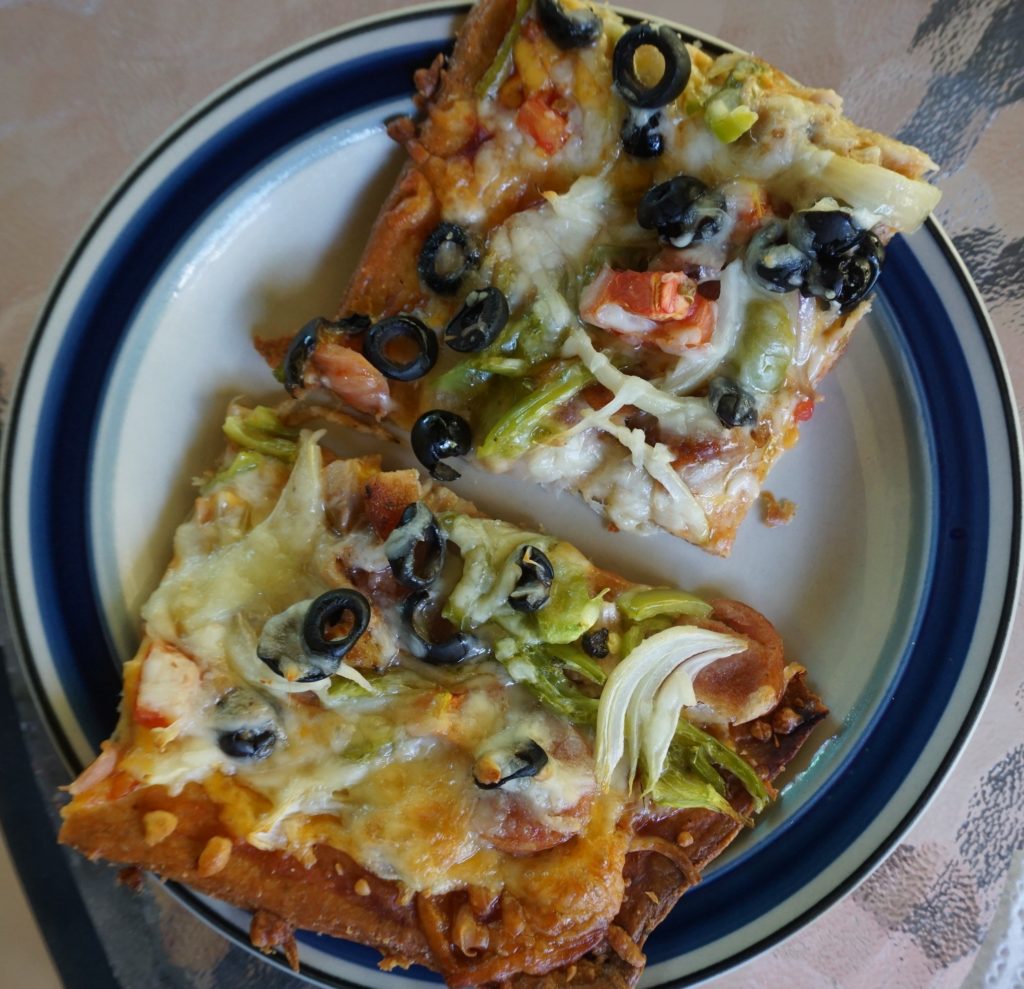 Pizza made with a mozzarella/almond flour dough & topped with loads of veggies 