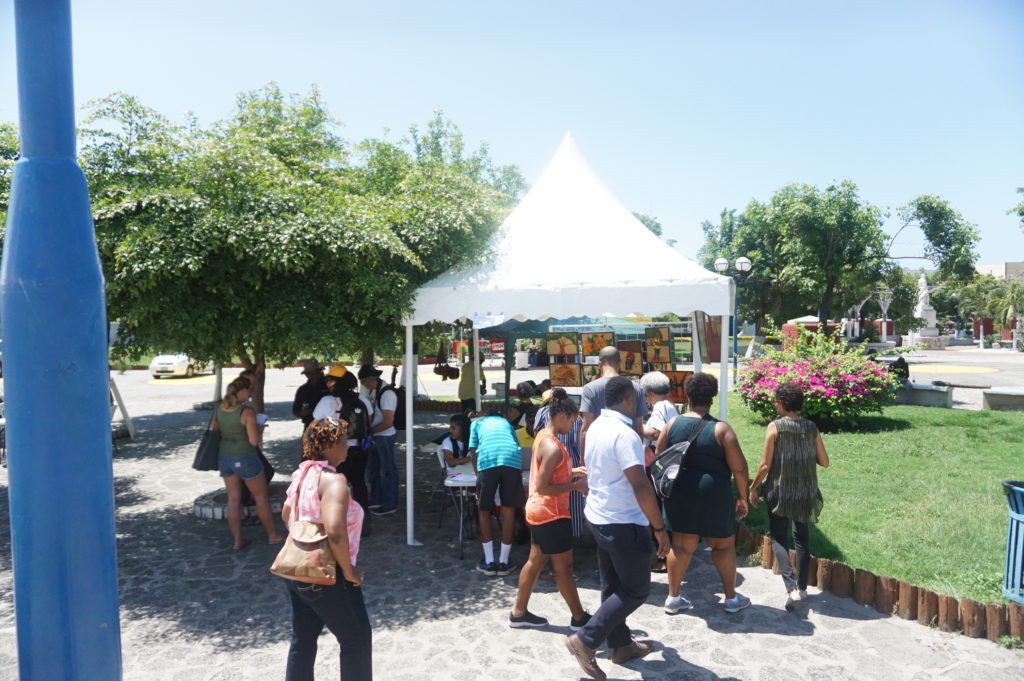 The registration tent at the Kingston Creative Artwalk in the St William Grant Park Downtown Kingston  