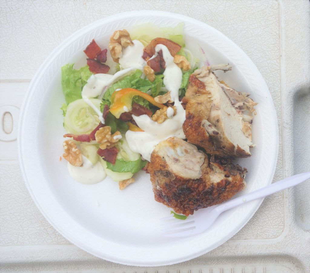 Rotisserie chicken with a well dressed salad