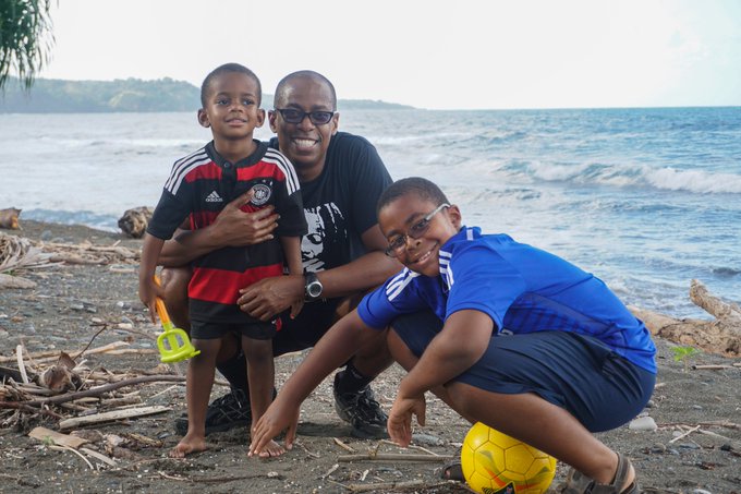 Father and sons on the beach