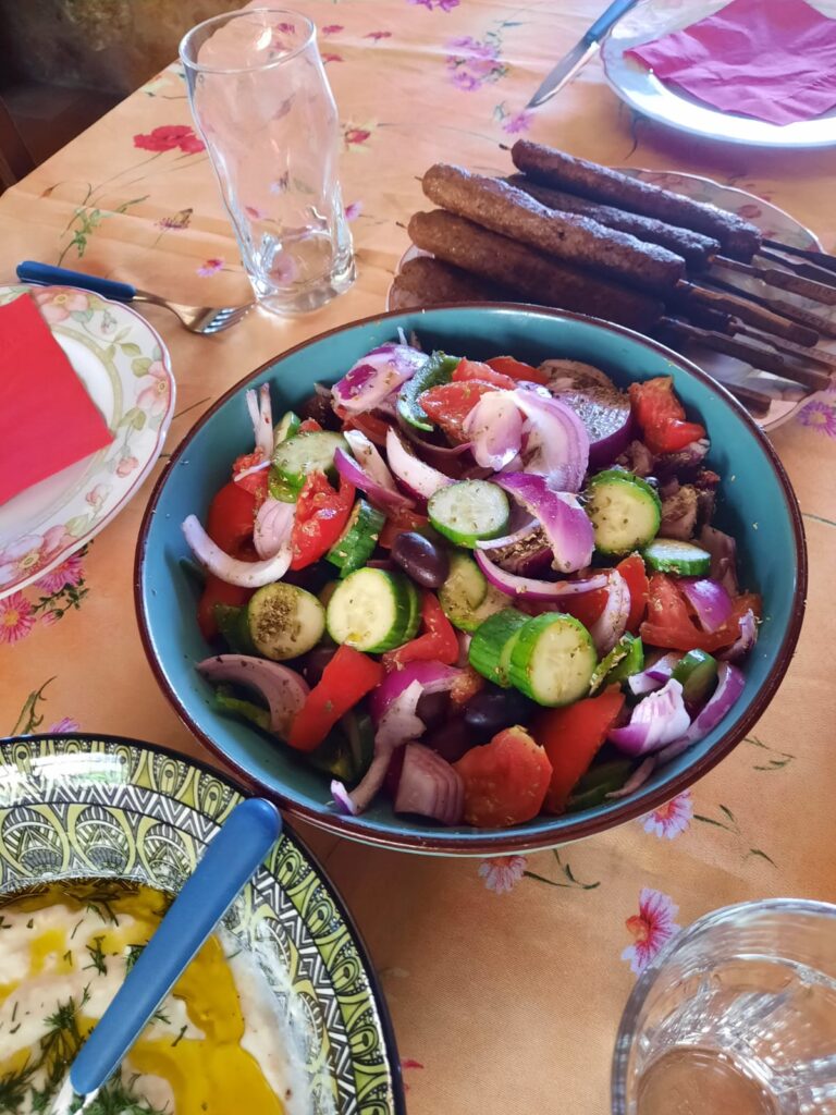 Tzatziki sauce, salad & mutton kebabs. 